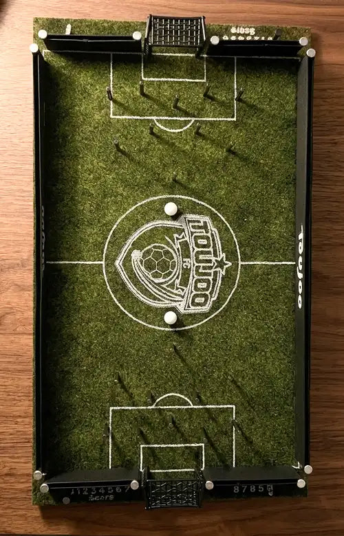 Toujoo football club game field with goalposts on a wooden surface